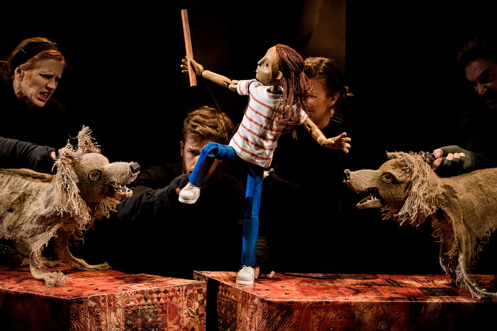 Lucy fighting off the wolves (image by Dan Tsantilis via the Little Angel Theatre, London)